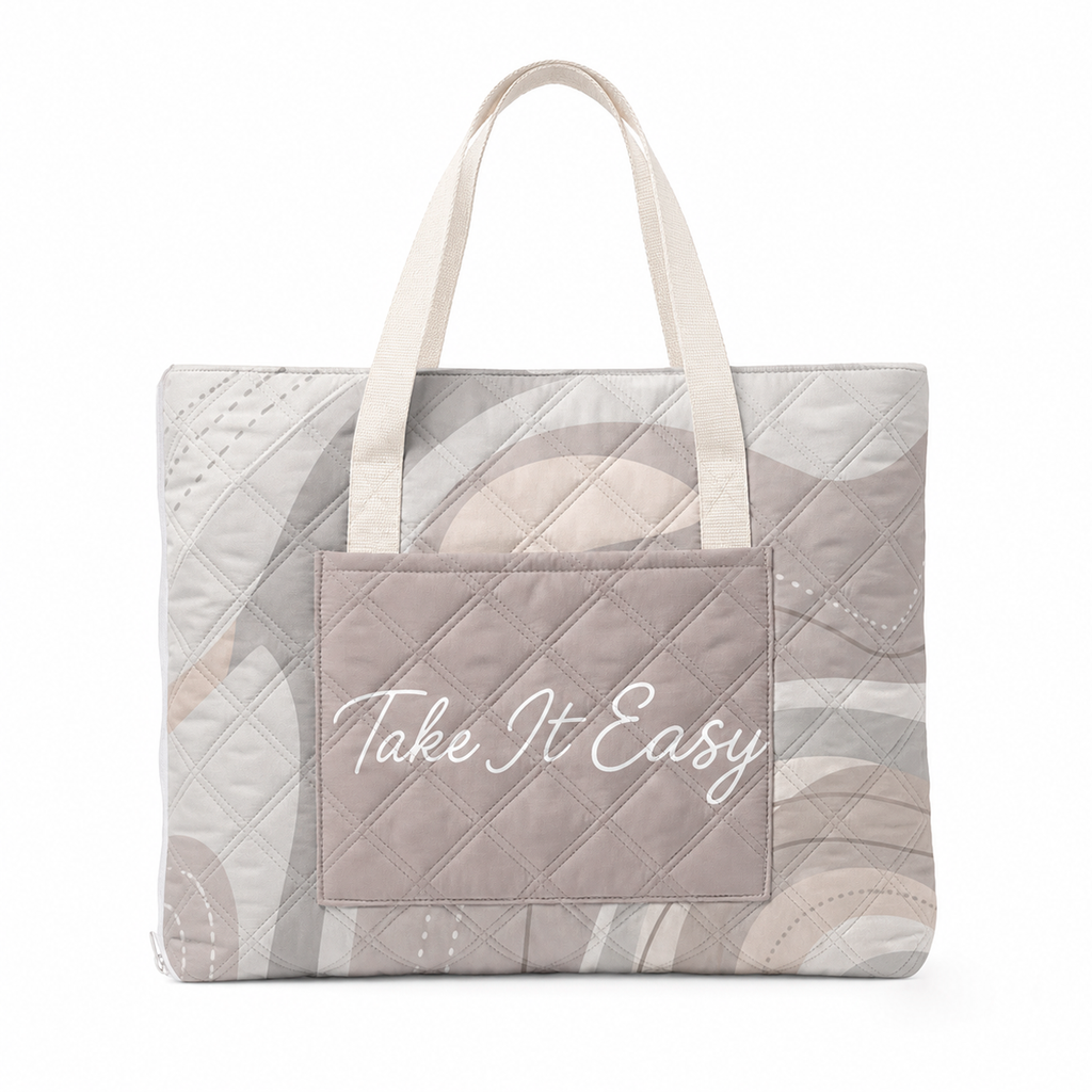 Taupe Take It Easy padded beach blanket folded into its built-in tote